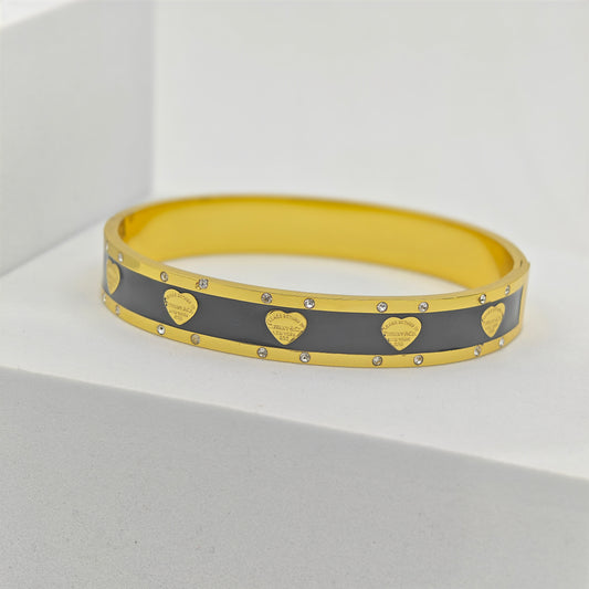 Designer 18K Gold-Plated Love Heart Charm Bracelet – Stainless Steel Adjustable Bangle with Black Enamel & Crystal Accents RGB417