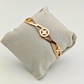 Elegant Harmony: 18K Gold Plated Bangle with Interlocking Charms and CZ Details RGB207