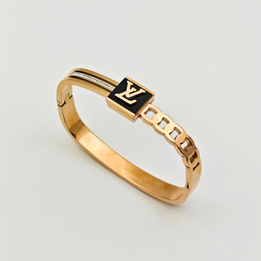 Designer Chic: 18K Gold Plated Bangle with Signature LV Monogram and Cutout Details RGB218