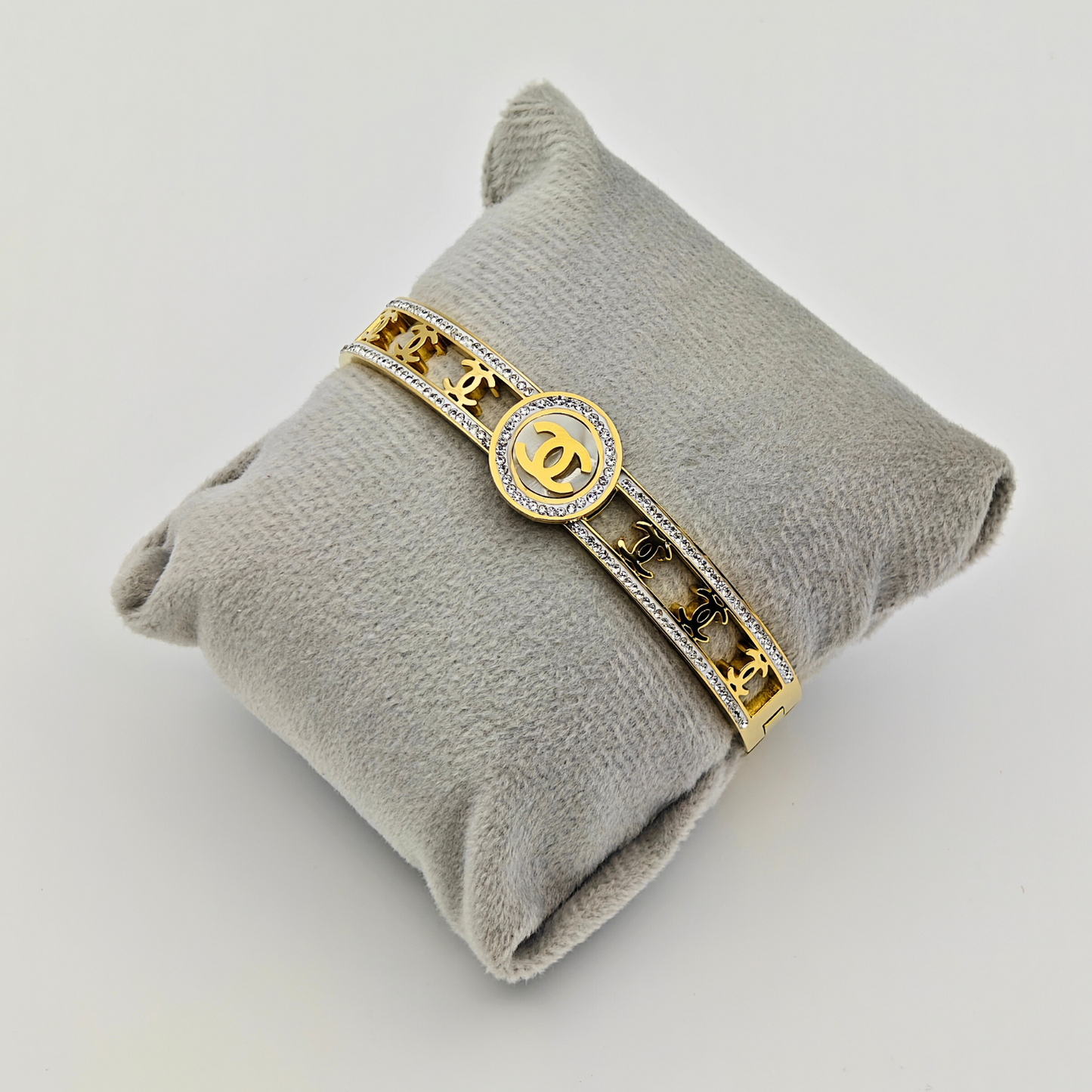 Regal Emblem: 18K Gold Plated Bangle with Iconic Logo and Crystal Pave  RGB221