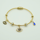 Elegant Gold-Plated Evil Eye Charm Bangle with Crystal Accents and Blue Teardrop Pendant RGB401