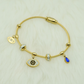 Elegant Gold-Plated Evil Eye Charm Bangle with Crystal Accents and Blue Teardrop Pendant RGB401