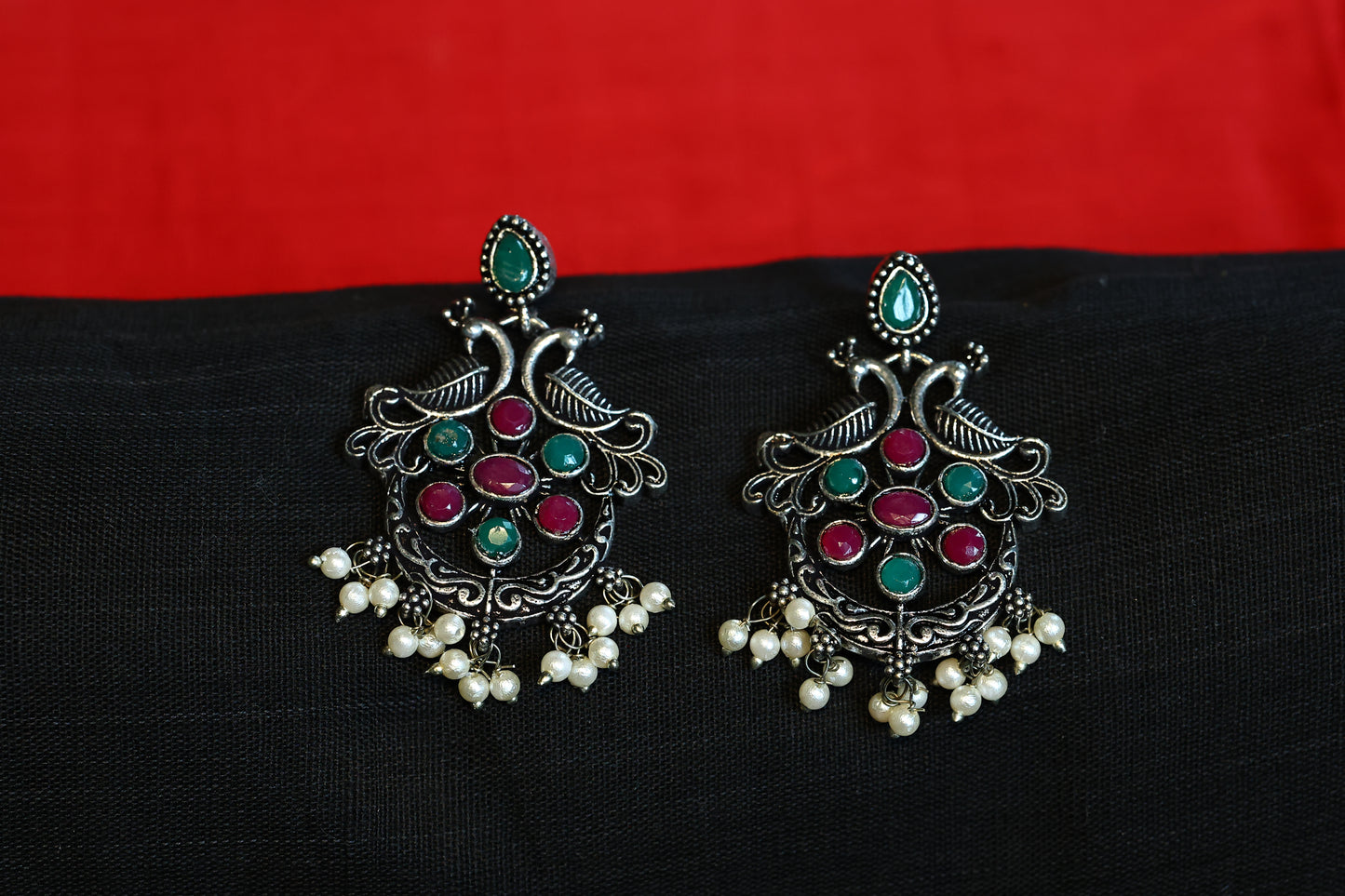 Premium German Silver Peacock Earring with Red & Green Stones and Elegant Pearls