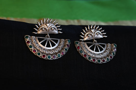 Surya Motif Premium German Silver Earrings with Red & Green Stones