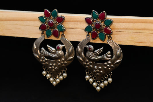 Bird Nest Motif Silver Lookalike Earring with Red and Green Stones and Pearl Drops GSE71RG