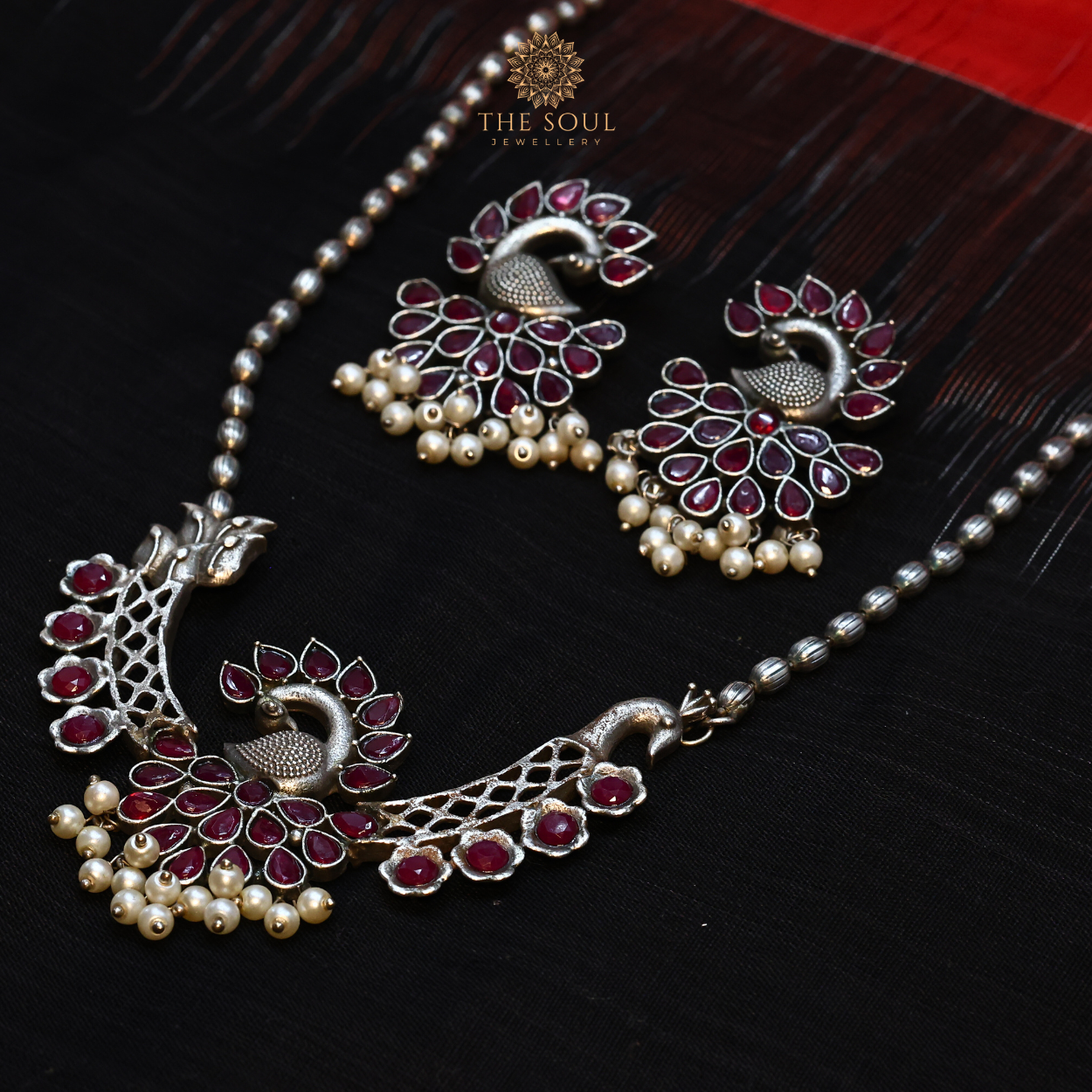 German Silver-Plated Peacock Necklace set with Red Gemstones and Gleaming Pearl Drops