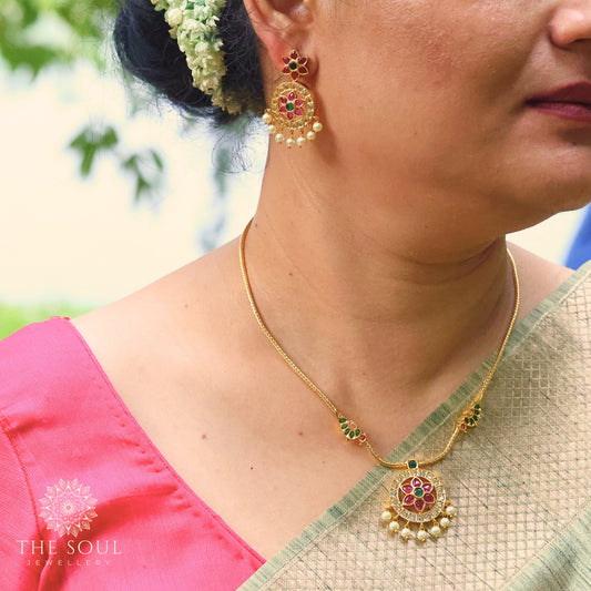 Madhavi Antique Gold Plated Short Necklace Set with Flower Design