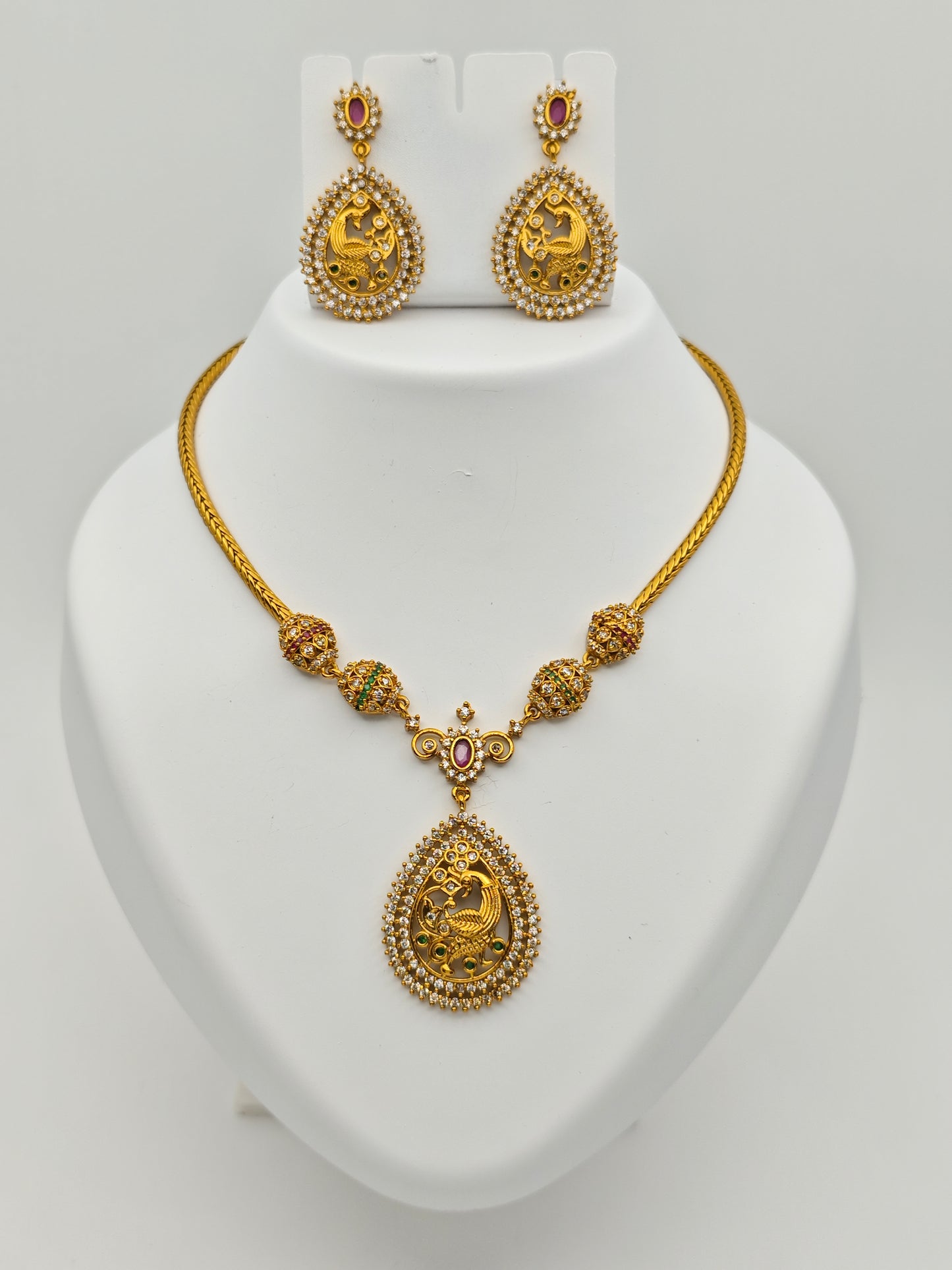 Aloka Antique Gold Plated Temple Necklace Set with Intricate Peacock Pendant and Ruby Accents – Traditional Ethnic Jewelry MGNS310