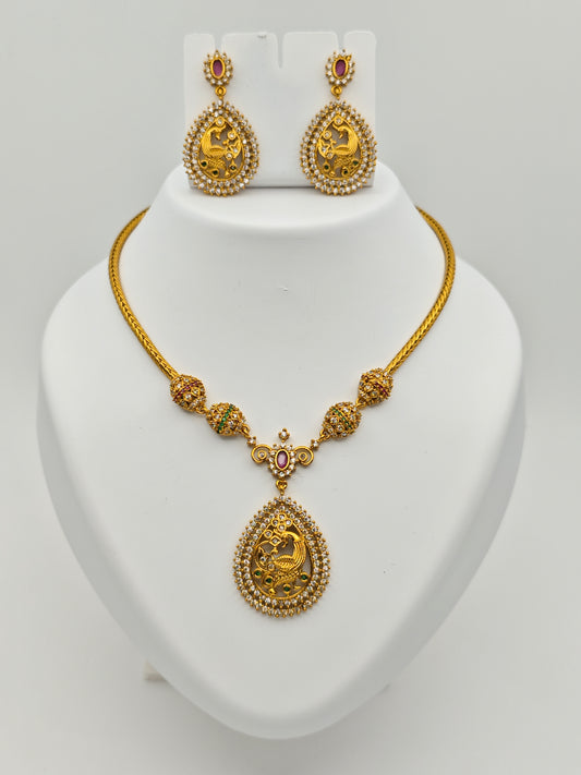 Aloka Antique Gold Plated Temple Necklace Set with Intricate Peacock Pendant and Ruby Accents – Traditional Ethnic Jewelry MGNS310