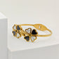 Elegant 18K Gold Plated Clover Bangle with Black and White Enamel Accents RGB255