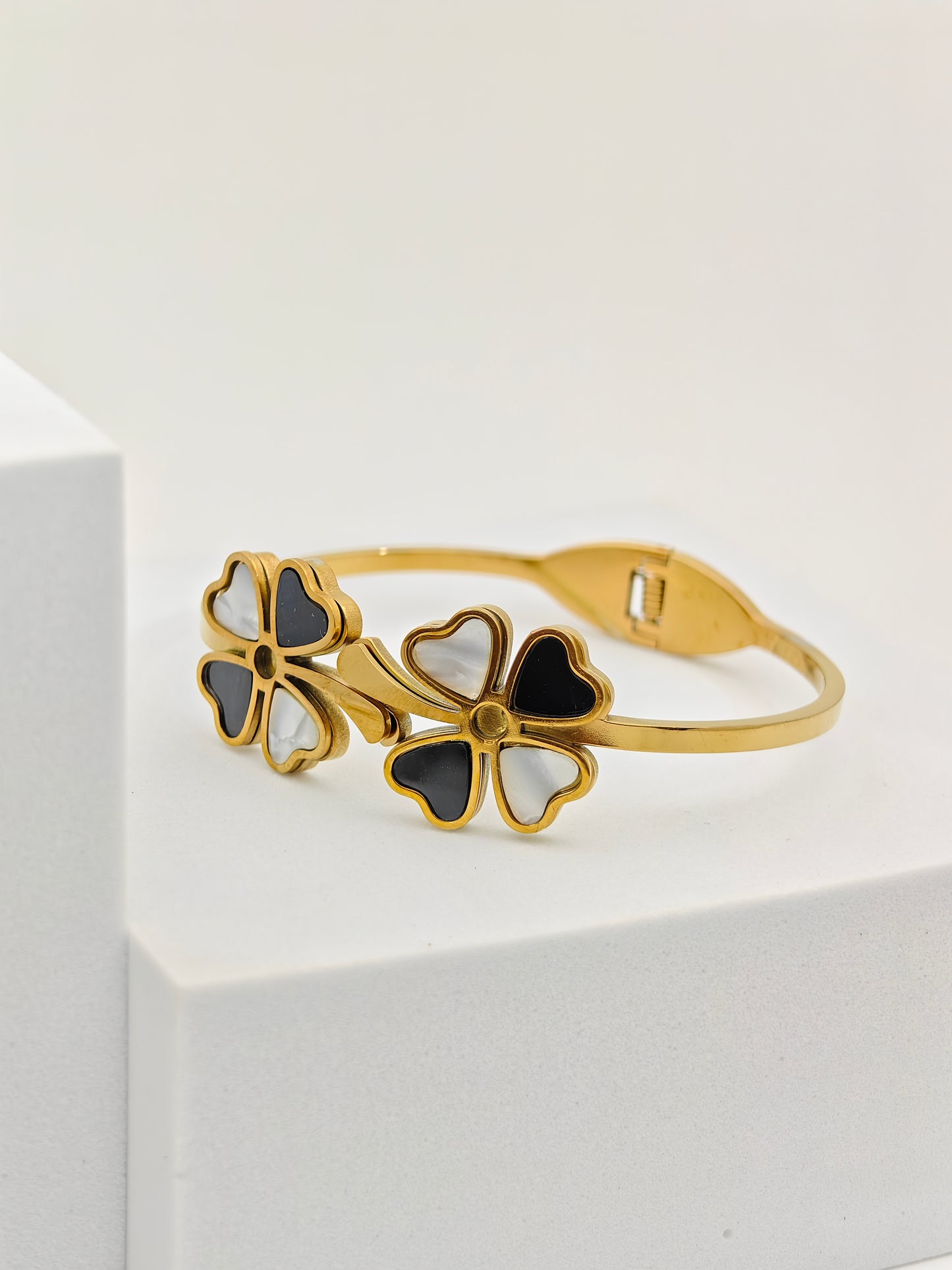 Elegant 18K Gold Plated Clover Bangle with Black and White Enamel Accents RGB255