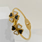 Elegant 18K Gold Plated Clover Bangle with Black and White Enamel Accents RGB255