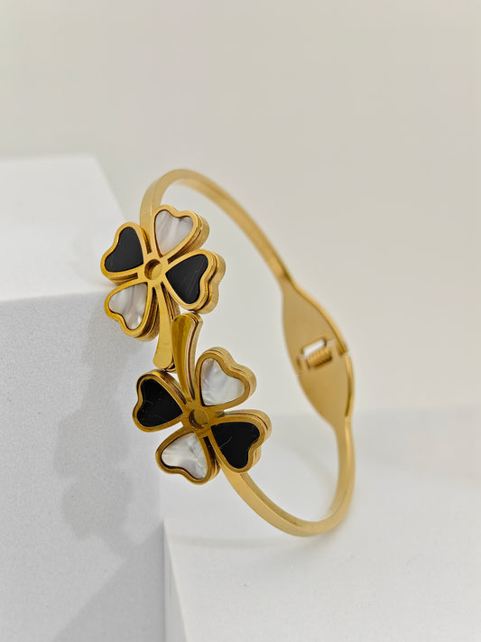 Elegant 18K Gold Plated Clover Bangle with Black and White Enamel Accents RGB255