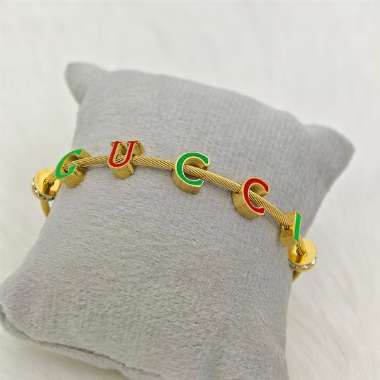 Luxury 22K Gold-Plated Gucci-Inspired Charm Bracelet – Anti-Tarnish Stainless Steel Cable Bangle with Enamel Letter Charms RGB447