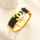 Luxury 18K Gold Plated Anti-Tarnish Bangle – Bold Black Enamel Designer Bracelet with Engraved Channel-Inspired Logo RGB511