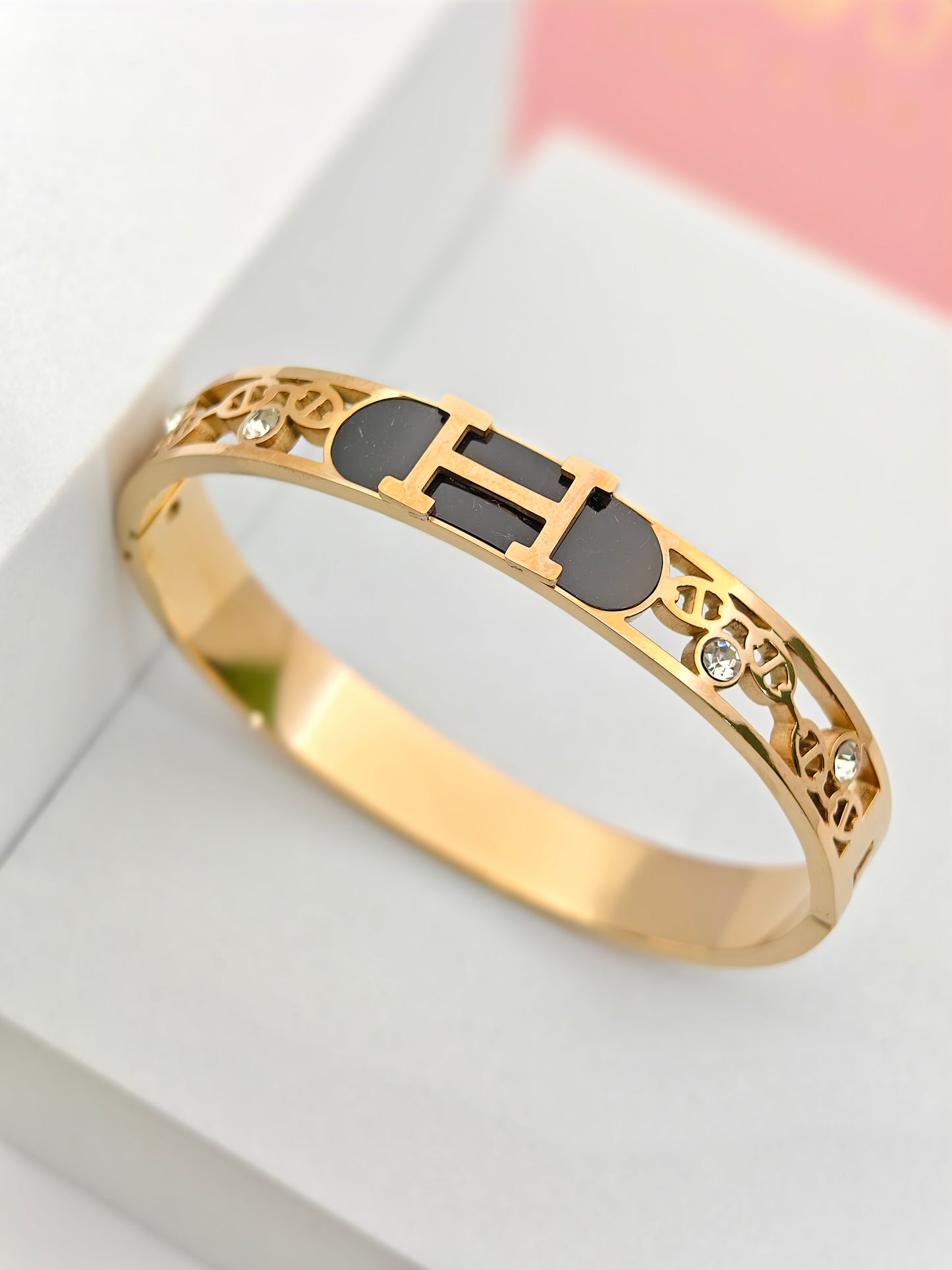 Hermes Engraved 18K Gold Plated Initial Bangle with Black Enamel and Crystal Details – Sophisticated and Stylish RGB288