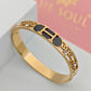 Hermes Engraved 18K Gold Plated Initial Bangle with Black Enamel and Crystal Details – Sophisticated and Stylish RGB288