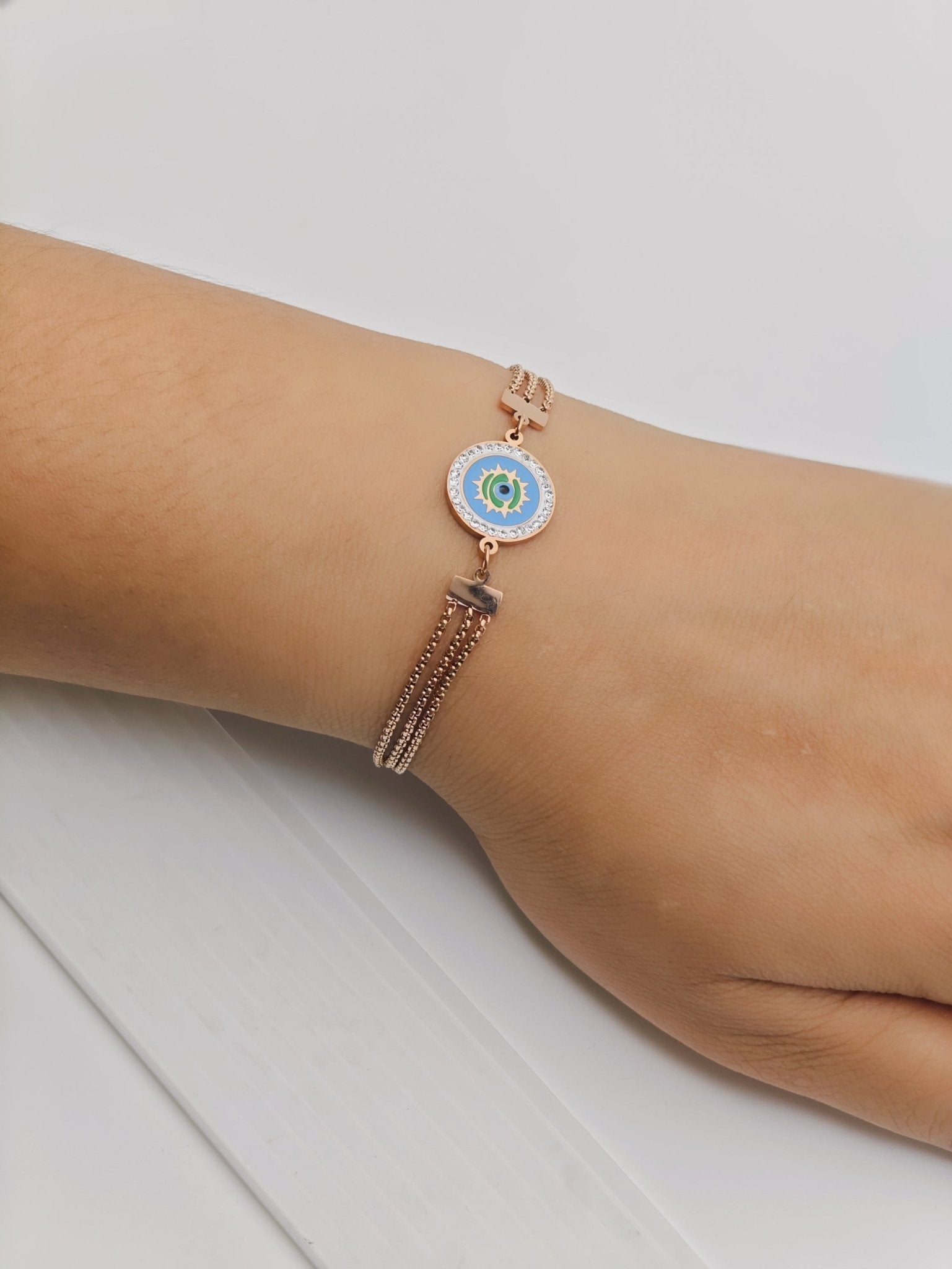 Elegant Rose Gold Plated Anti - Tarnish Bracelet with Blue Enamel Evil Eye Charm and Crystal Accents - The Soul Jewellery