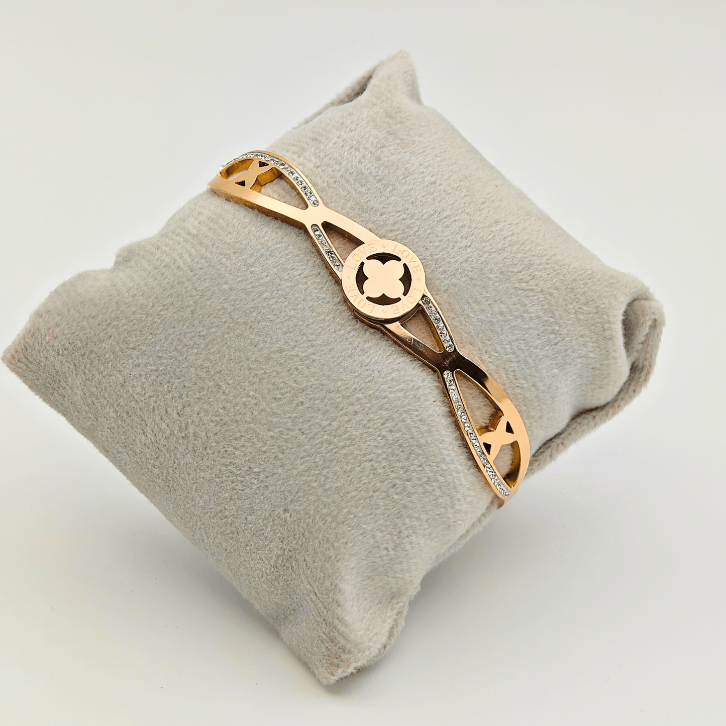 Elegant Harmony: 18K Gold Plated Bangle with Interlocking Charms and CZ Details RGB207 - The Soul Jewellery