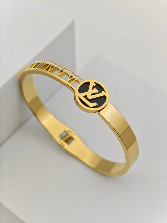 Luxurious 18K Gold Plated Anti - Tarnish Bangle with Louis Vuitton - Inspired Round Charm and Crystal Accents RGB273 - The Soul Jewellery