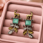 Handcrafted Dual-Tone Deer Motif Earrings with Green Stone Leaf Charms –Oxidised Earrings for Women - The Soul Jewellery
