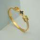 18K Gold - Plated Anti - Tarnish Bangle with Black Clover Design and Sparkling Crystal Highlights RGB355 - The Soul Jewellery