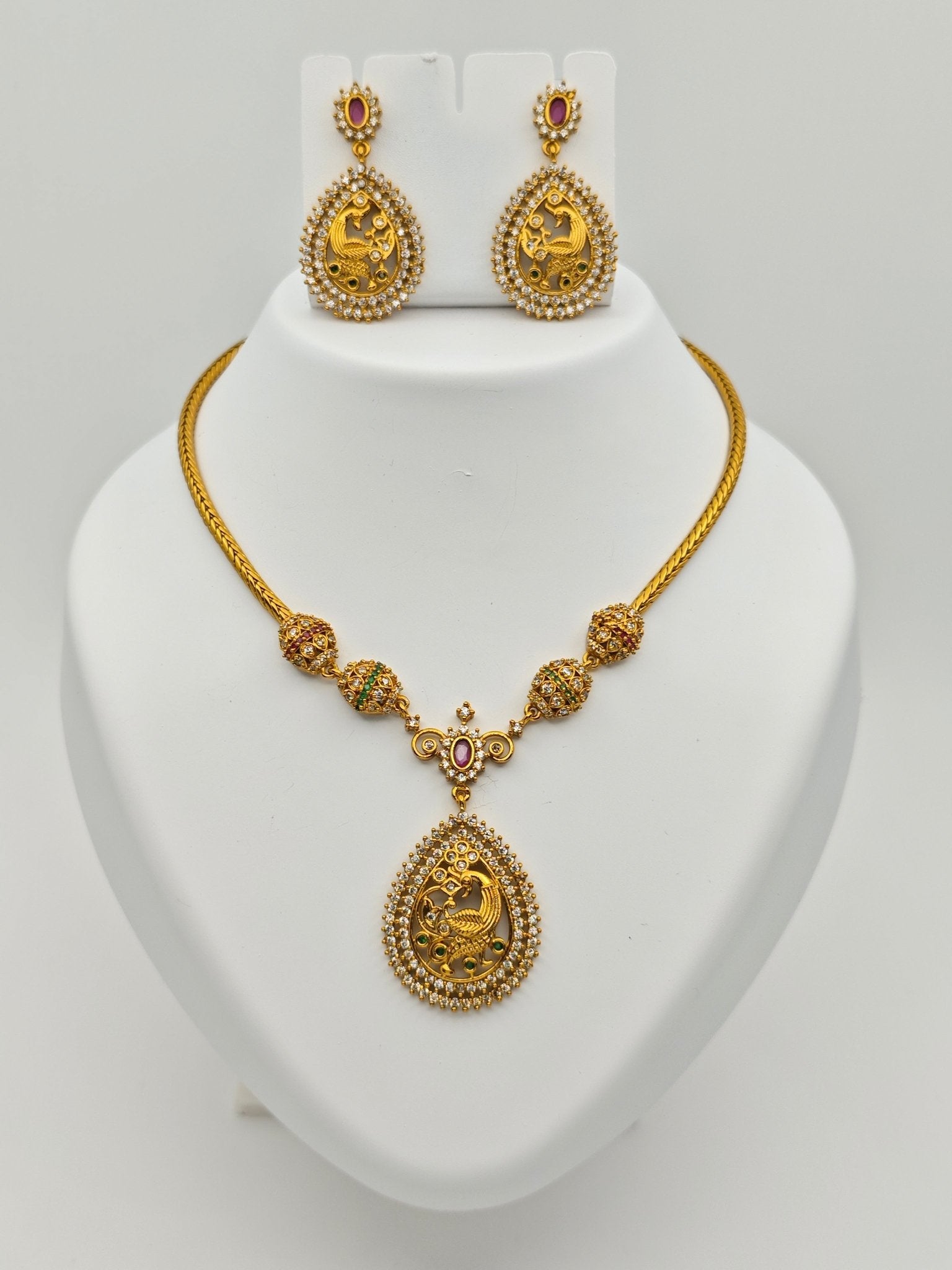 Aloka Antique Gold Plated Temple Necklace Set with Intricate Peacock Pendant and Ruby Accents – Traditional Ethnic Jewelry MGNS310 - The Soul Jewellery