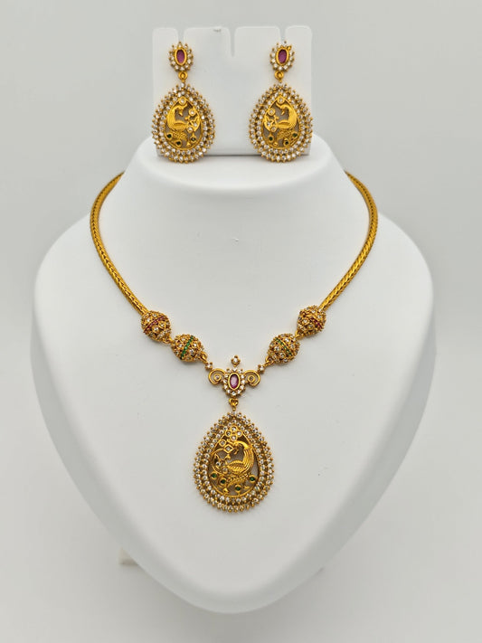 Aloka Antique Gold Plated Temple Necklace Set with Intricate Peacock Pendant and Ruby Accents – Traditional Ethnic Jewelry MGNS310 - The Soul Jewellery