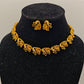 Adrika Antique Gold Plated Temple Choker Necklace Set with Floral Motifs and Emerald Accents – Traditional Ethnic Jewelry MGNS315 - The Soul Jewellery