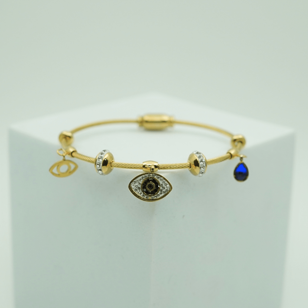 Elegant Gold - Plated Evil Eye Charm Bangle with Crystal Accents and Blue Teardrop Pendant RGB401 - The Soul Jewellery