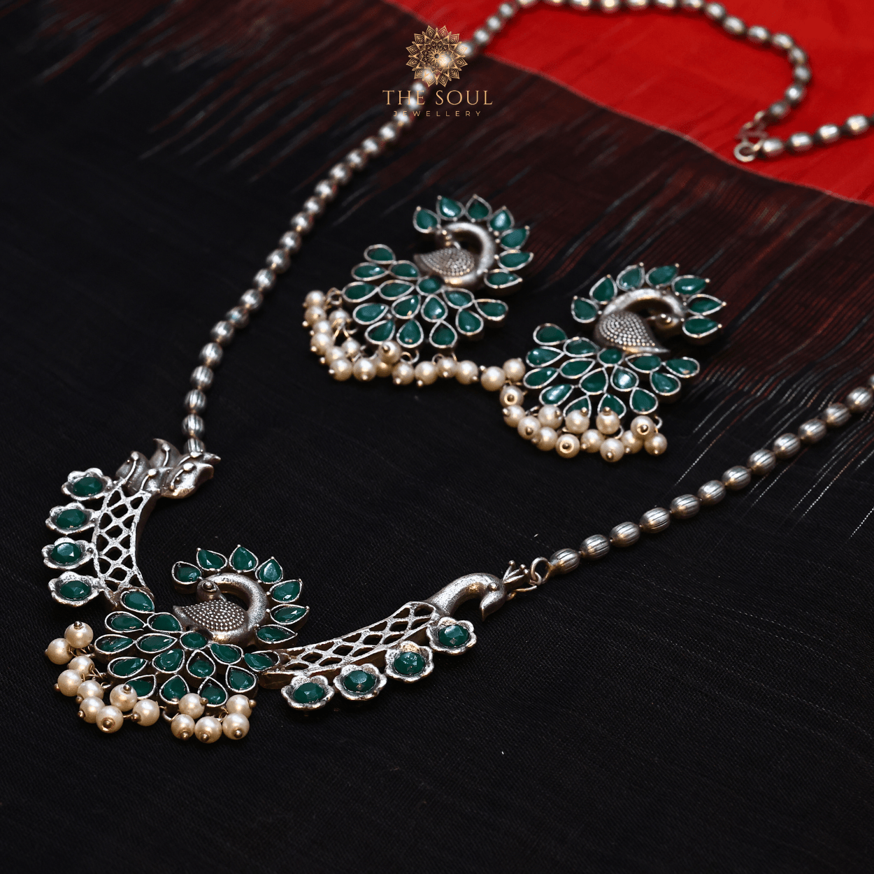 German Silver - Plated Peacock Necklace set with Green Gemstones and Gleaming Pearl Drops - The Soul Jewellery