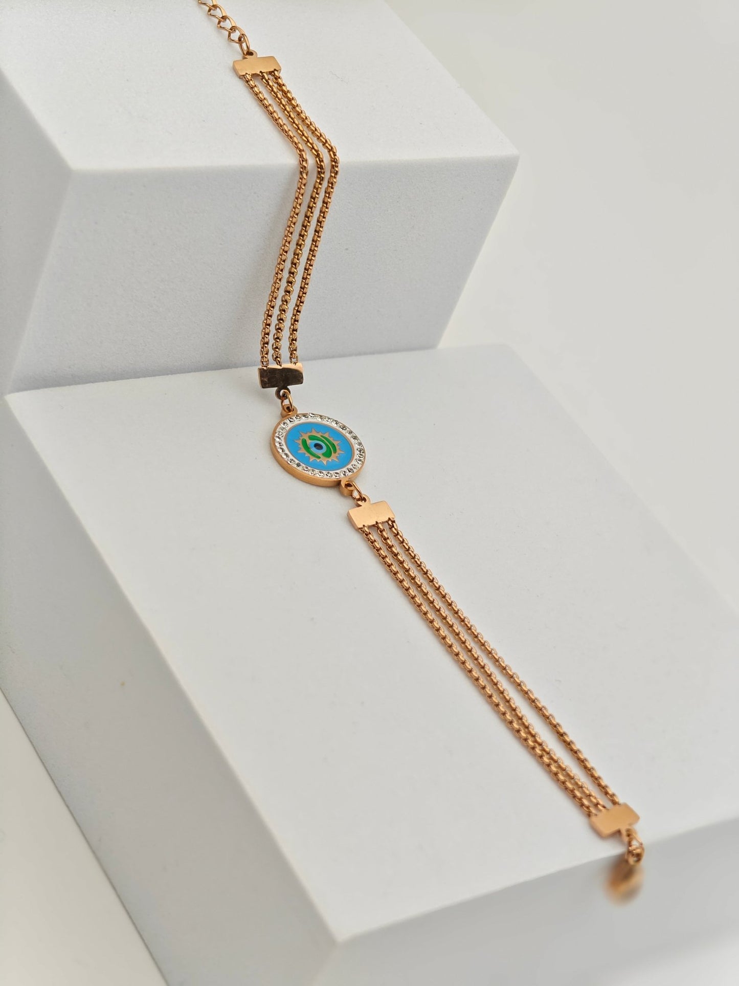 Elegant Rose Gold Plated Anti - Tarnish Bracelet with Blue Enamel Evil Eye Charm and Crystal Accents - The Soul Jewellery