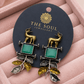 Handcrafted Dual-Tone Deer Motif Earrings with Green Stone Leaf Charms –Oxidised Earrings for Women - The Soul Jewellery
