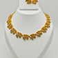 Adrika Antique Gold Plated Temple Choker Necklace Set with Floral Motifs and Emerald Accents – Traditional Ethnic Jewelry MGNS315 - The Soul Jewellery