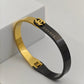 Chic Black and Gold Anti - Tarnish Bangle with Chanel - Inspired Design and Dual - Tone Finish RGB269 - The Soul Jewellery
