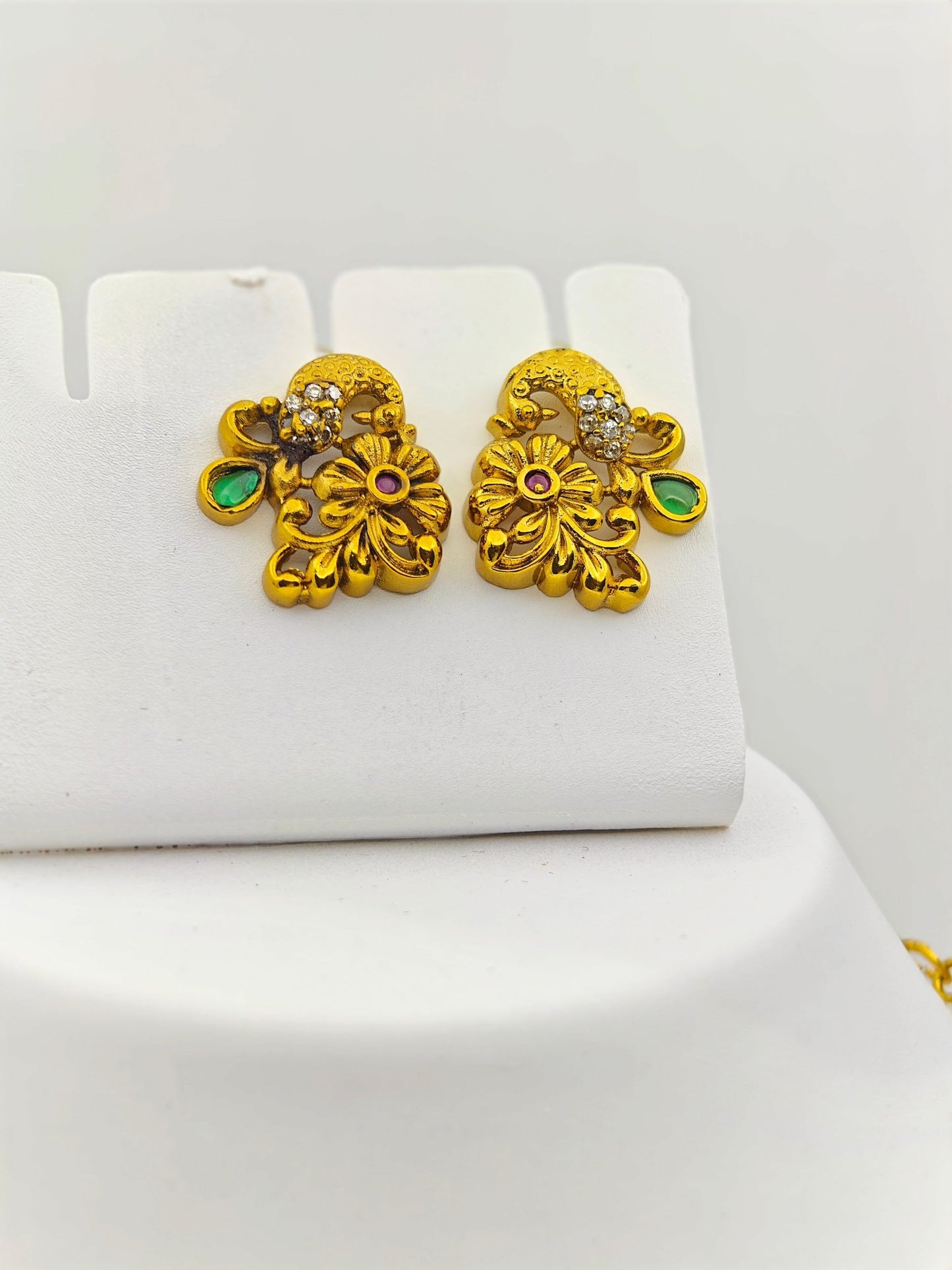 Adrika Antique Gold Plated Temple Choker Necklace Set with Floral Motifs and Emerald Accents – Traditional Ethnic Jewelry MGNS315 - The Soul Jewellery