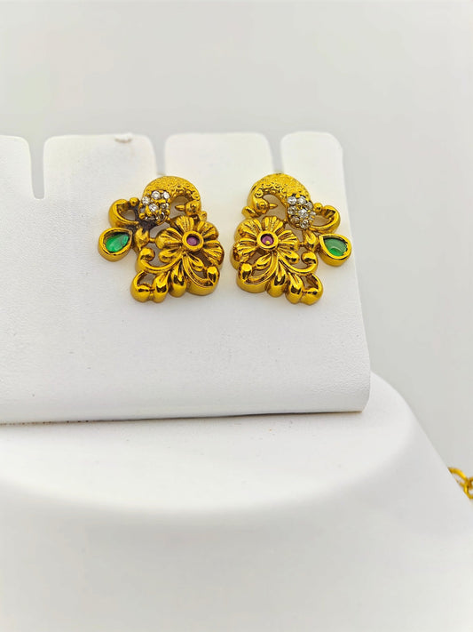 Adrika Antique Gold Plated Temple Choker Necklace Set with Floral Motifs and Emerald Accents – Traditional Ethnic Jewelry MGNS315 - The Soul Jewellery