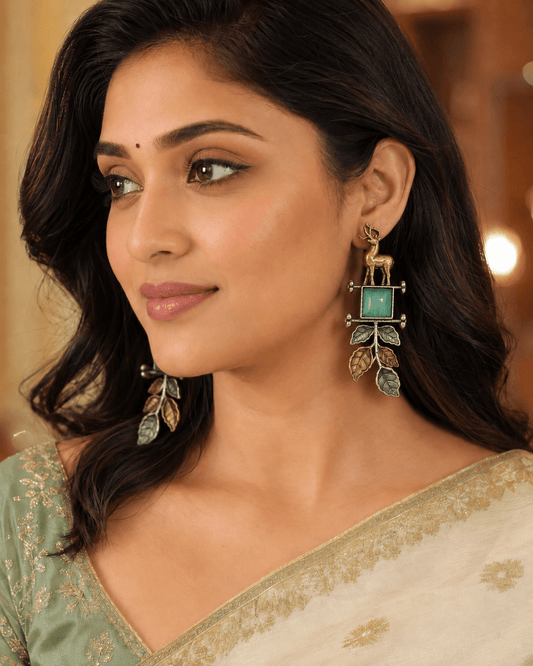 Handcrafted Dual-Tone Deer Motif Earrings with Green Stone Leaf Charms –Oxidised Earrings for Women - The Soul Jewellery