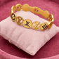 AURÉLIA MONOGRAM AMORE Demi - Fine Gold Bracelet for Men & Women | LV - Inspired Anti - Tarnish Kada - The Soul Jewellery